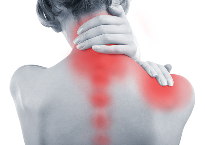 Young woman with neck and shoulder pain close up